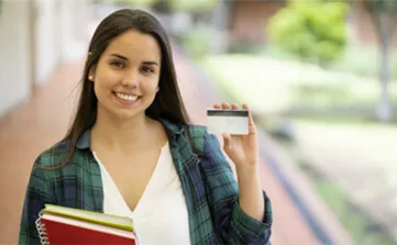 Student holding ID Card